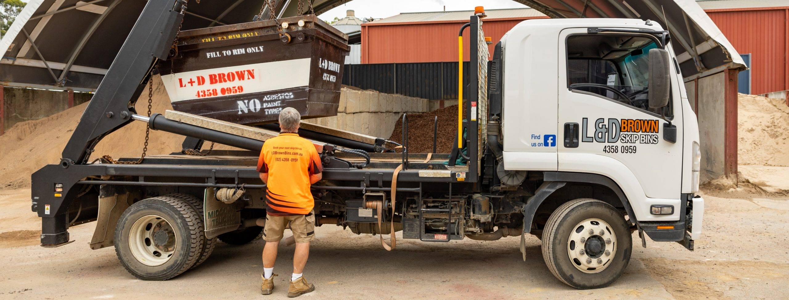 L & D Brown Skip Bins Employee Loading Bins in Central Coast