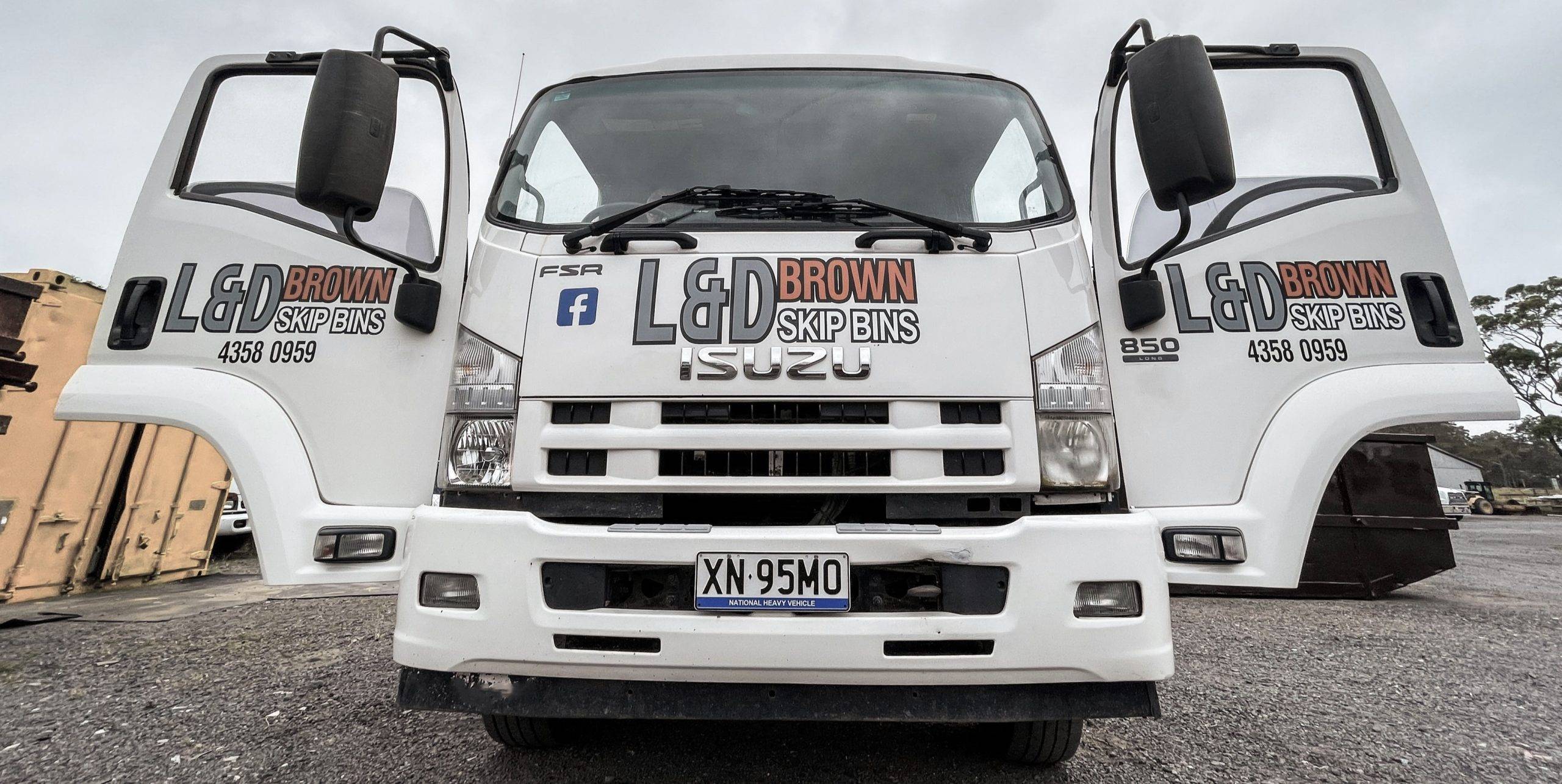 L & D Brown Skip Bins Truck on Road in Central Coast