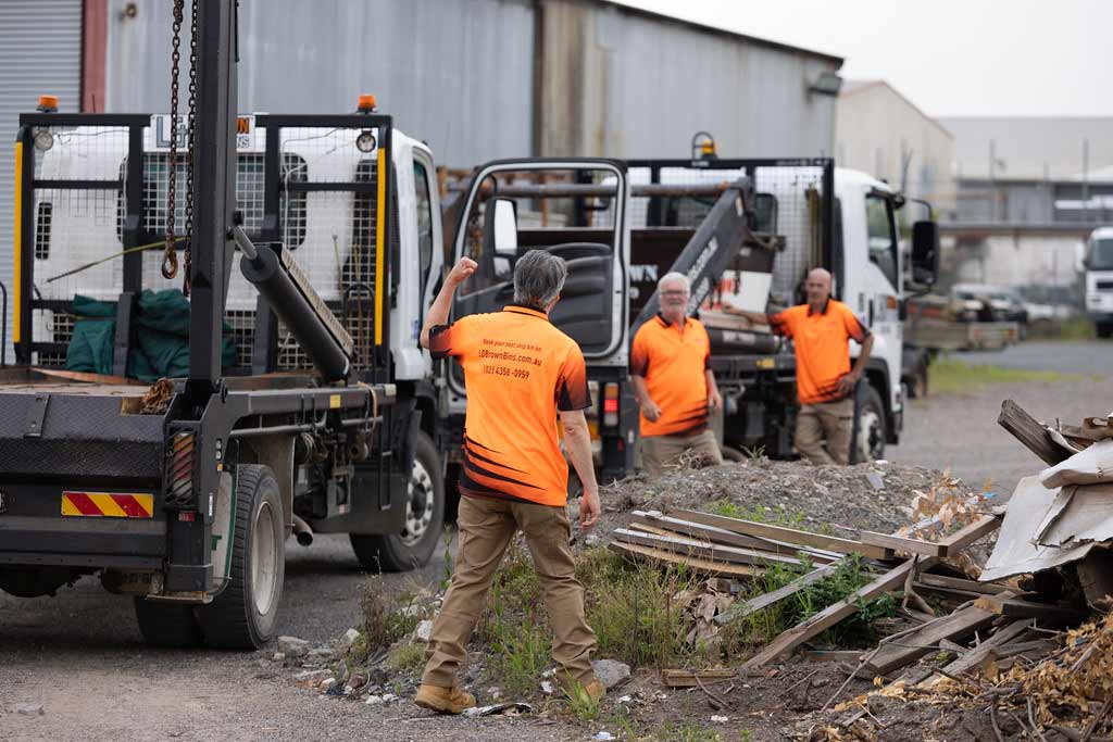 Construction Workers Unloading Materials