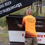Crane Lifting a Large Skip Bin for Hire Service in Central Coast